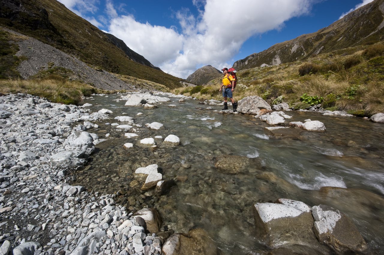 The author fords the Edwards River en route to Taruahuna Pass