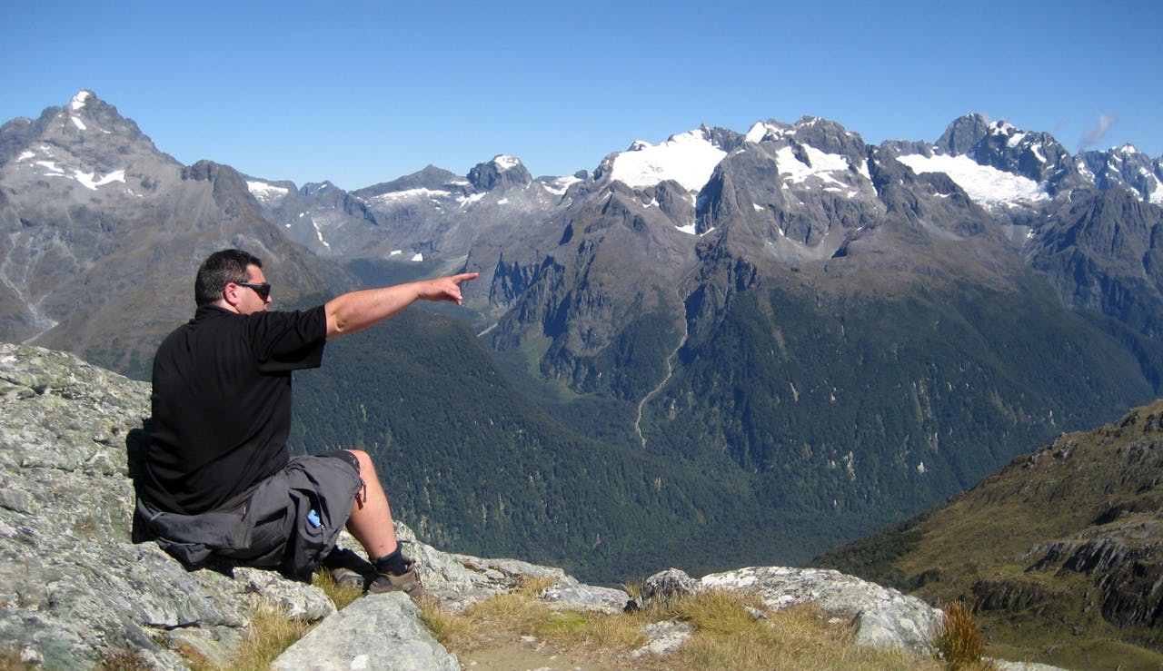 New Zealand peak bagging instigator Jon Povey enjoys the top of Conical Hill, off the Routeburn Track in Fiordland. Photo: Julia Becker