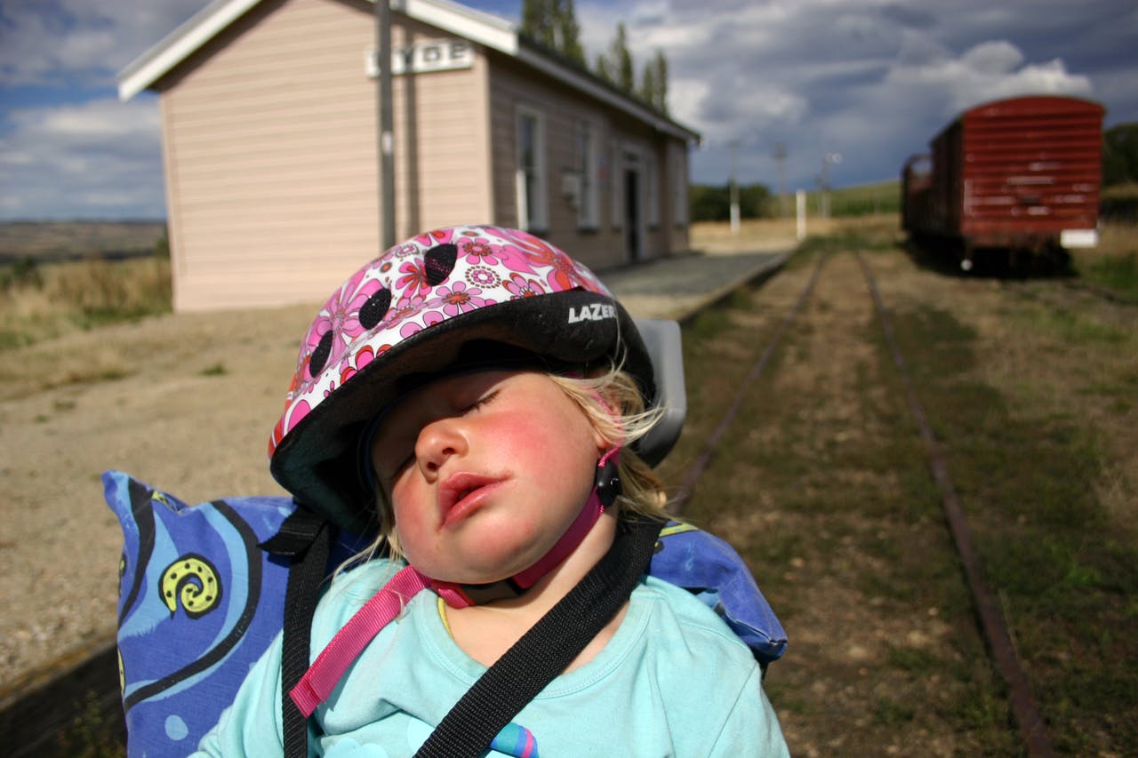 Anika fast asleep on the back of the bike drew many exclamations of surprise from other cyclists. Photo: Edith Leigh