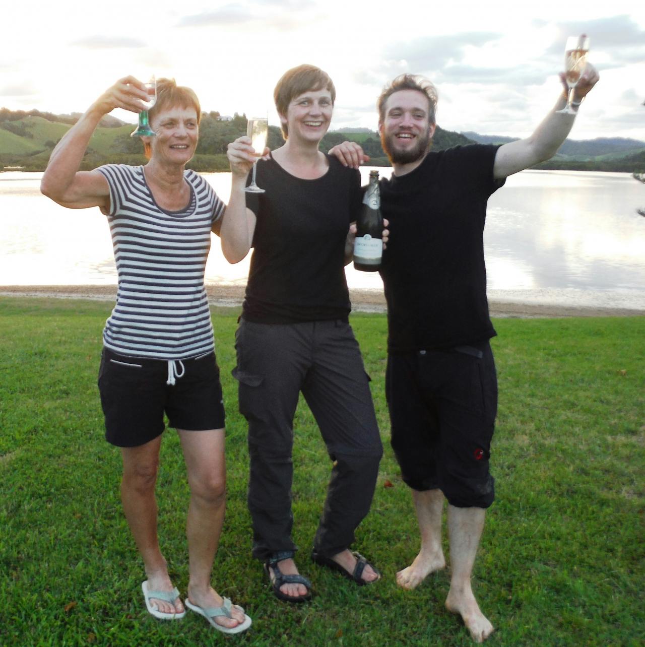 Trampers Helen, Hana and Simon were treated to a bottle of champagne to celebrate Whananaki Holiday Park's 100th TA.