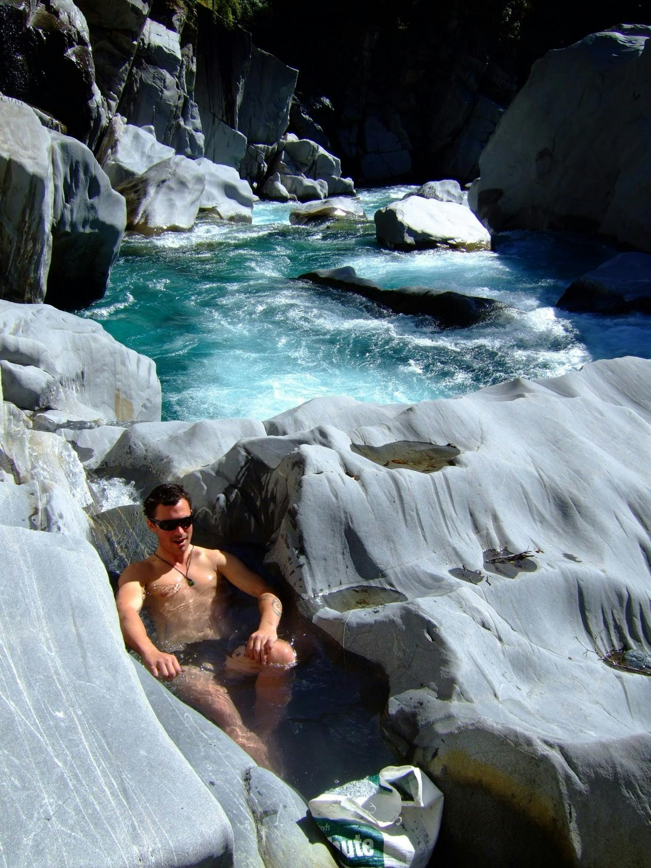 Soaking weary muscles in a hotpool, like this one on the Waitaha River, is one of life’s joys. Photo: Sally Jackson