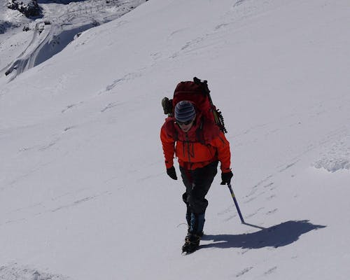 When traversing slopes, roll your ankle to ensure all points of the crampon contact the surface