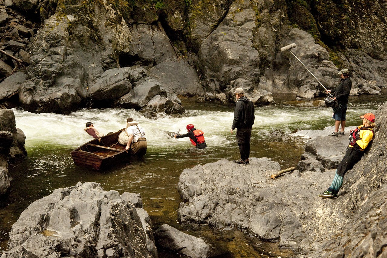 The film crew watch as Kevin and Jamie capsize their punt on the Motu River. Photo: Shaun Barnett/Black Robin Photography