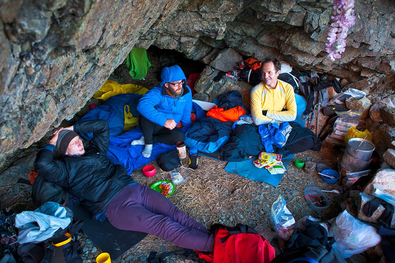 Climbers rest at their rock bivvy after a day climbing in the Darran Mountains – the new centre of NZ climbing. Photo: Mark Watson