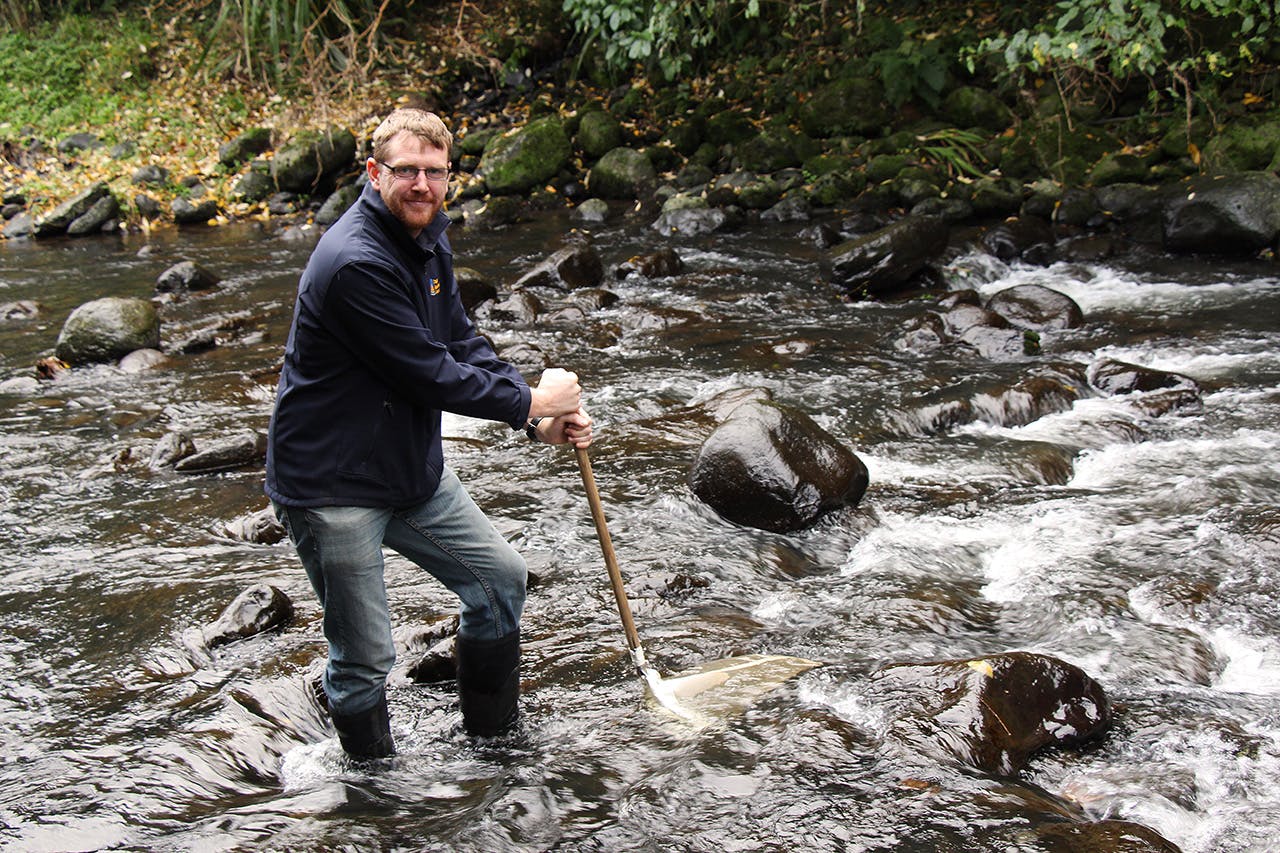 Dean Olsen’s job as a freshwater ecologist sees him collecting fish and algae samples. Photo: Edith Leigh
