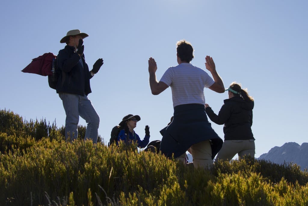 Members of the Aetherius Society pray part way up Mt Wakefield. Photo: Anna Pearson