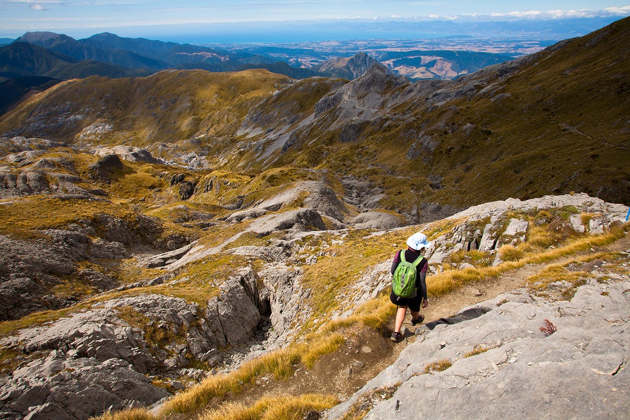 Descending through karst landscape below Mt Arthur. Photo: Nick Groves