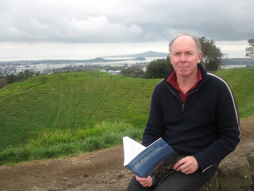 Geologist Bruce Hayward with one of his books, Volcanoes of Auckland. Photo: Matthew Pike