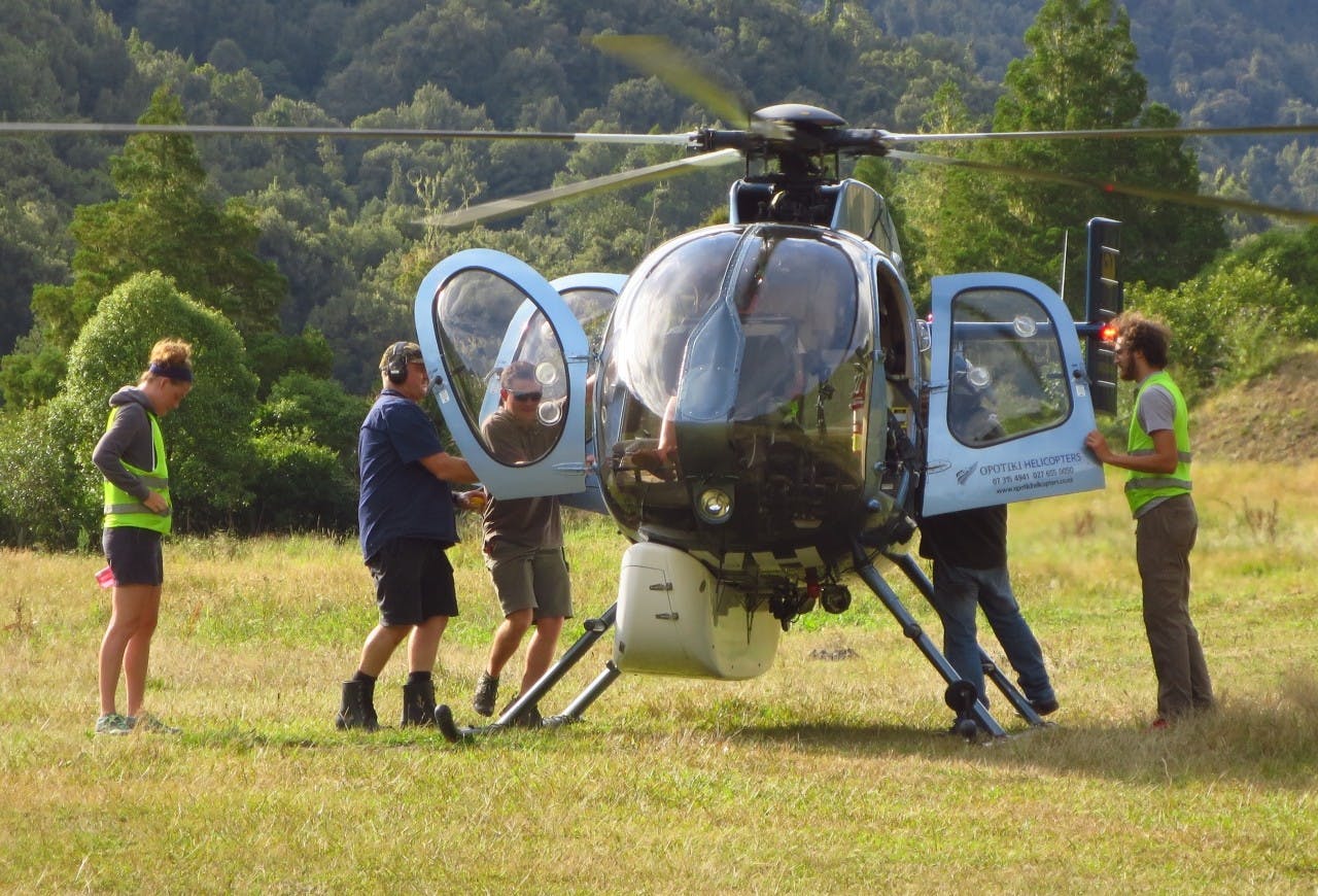Boarding a helicopter in preparation for a flight to Te Pua Hut.