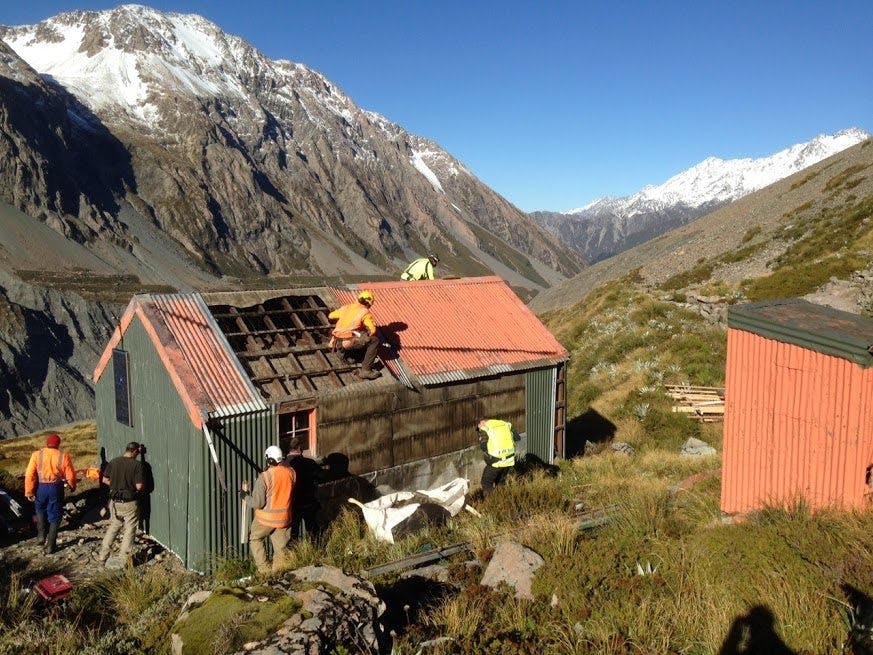 Hooker Hut being dismantled before being removed. Photo: DOC