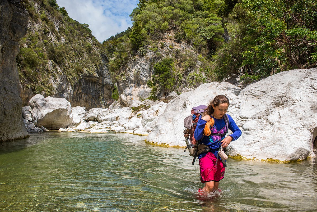 The trip to Isolation Hut requires wading the Waima River. Photo: Pat Barrett