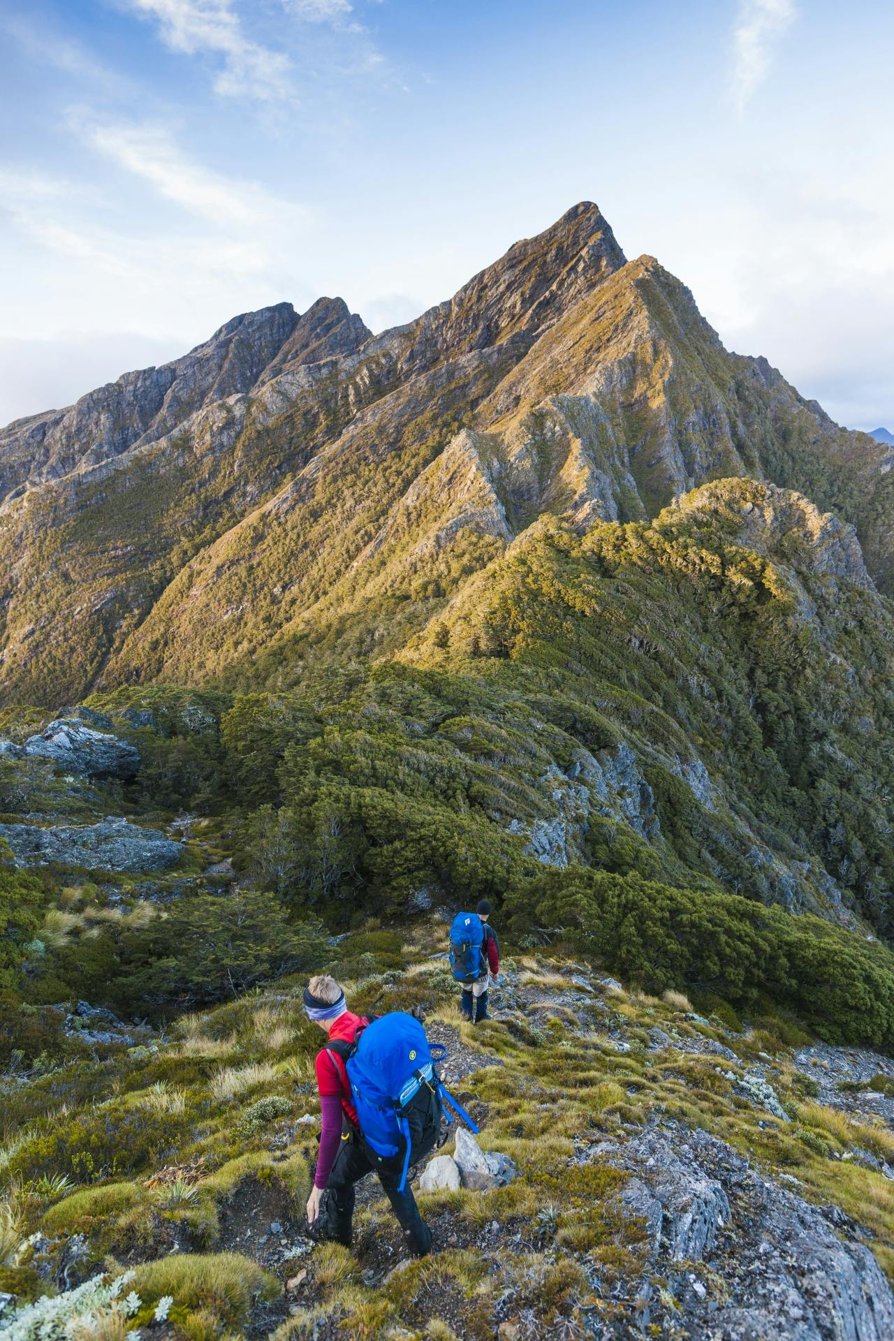 Morning after the storm, Hana and Pete approach the Dragons Teeth. Anatoki Peak in background