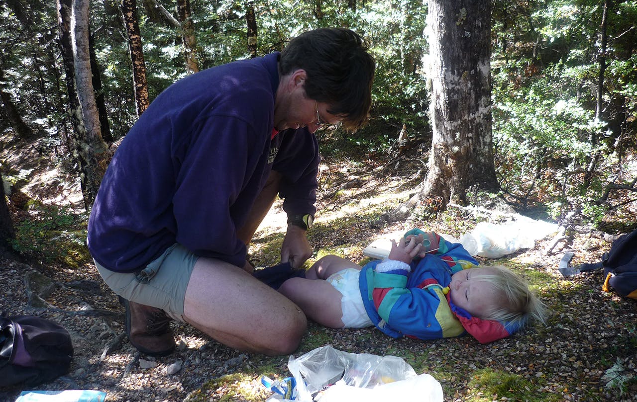Nappy changes are an unavoidable part of tramping with babies. Photo: Margaret Carpenter