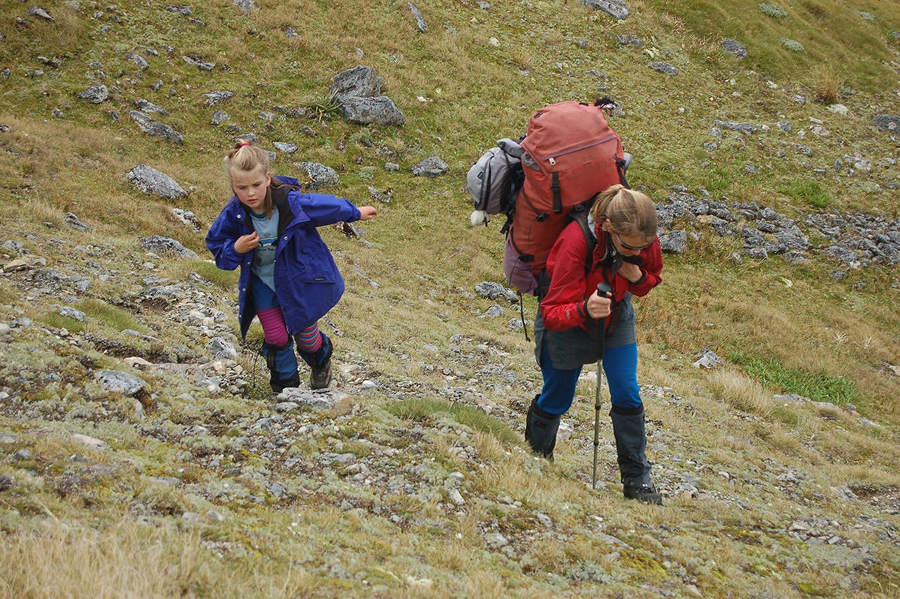  Heavy loads are a reality of tramping with young children. Photo: David Norton