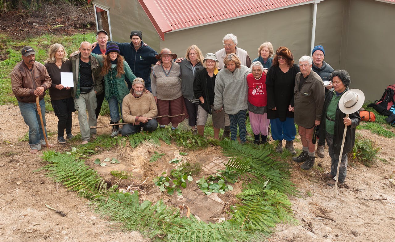 Protestors gathered round the stump the 500 year old kahikatea at Mokihinui Forks hut. Photo: Fraser Crichton
