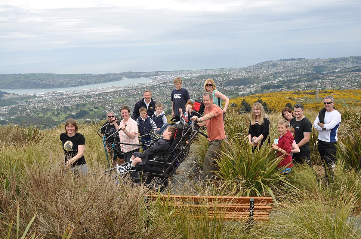 Callum Flett, Finn Casey and a crowd of supporters take in the view from Flagstaff. Photo: Barb Gee