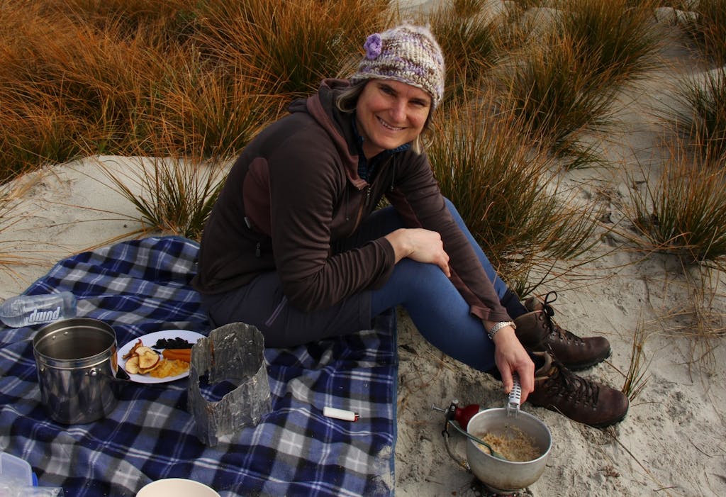 The author taste-testing a dehydrated meal in the field. Photo: Nik Leigh