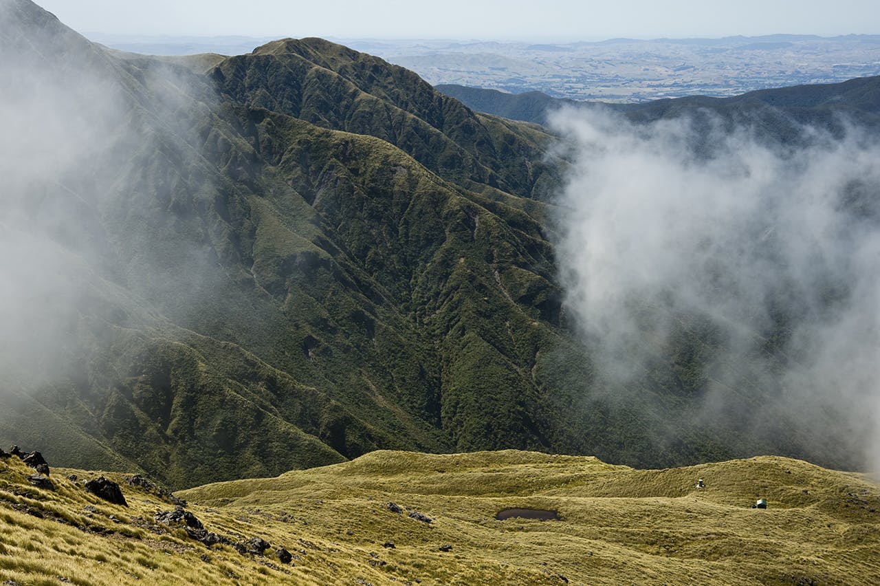 Clearing mist reveals Arete Hut. Photo: Shaun Barnett/Black Robin Photography