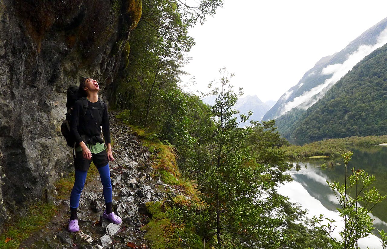 Bridget quenches her thirst from cliffs above Te Moana o Nohorua, Lake Ada. Photo: Nic Low