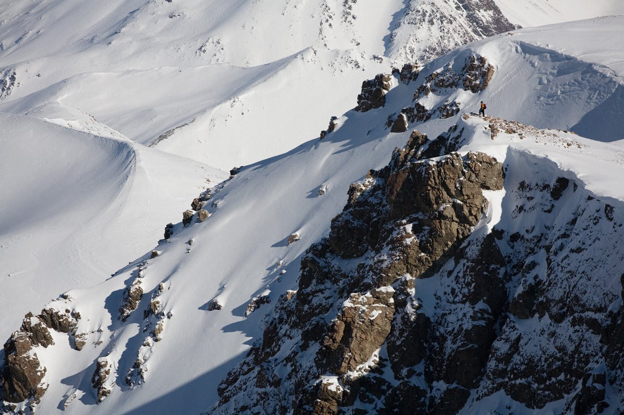 Louise Parker surveys the terrain above Dumb-bell Lake. Photo: Mark Banham