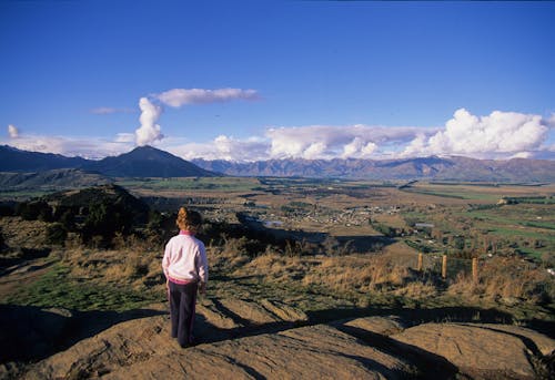 Child views Wanaka Basin from Mt Iron Wanaka