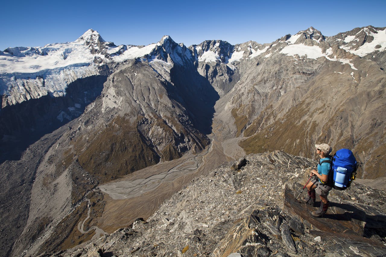 On the summit of The Gladiator (2125m) an incredible panorama opens. From left: Sierra Range and Douglas Neve; Mount Sefton; Mount Thomson, Eagle Peak, Maunga Ma and Mount Isabel. Harper's Rock Bivouac is the black triangular boulder by the dry streambed at bottom left. Photo: Mark Watson