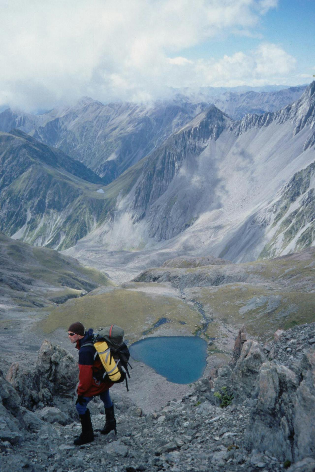 Surveying Taruahana Pass and Tarn Col from the ridge above Lake Mavis. Photo: Richard Davies