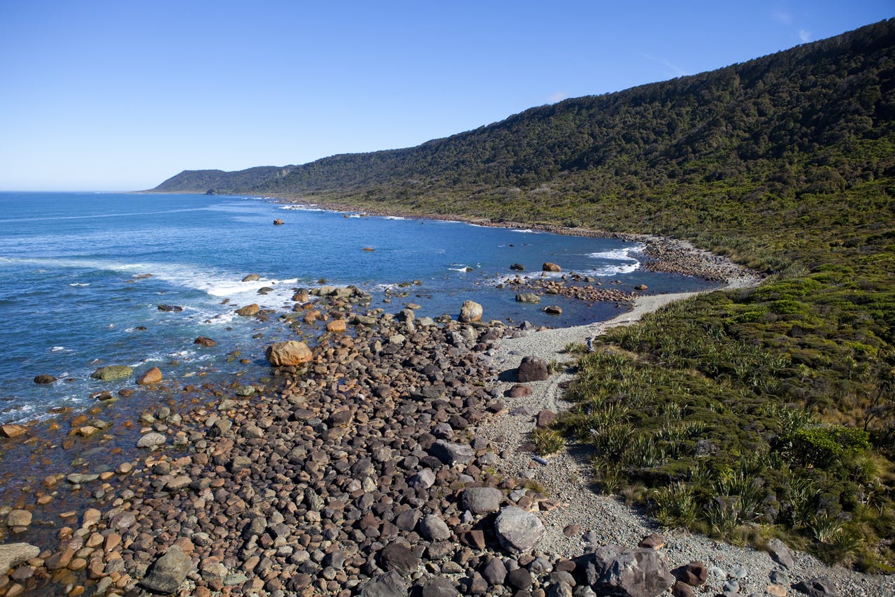 Landing at Big Bay during a heli-surf trip to Big Bay, West Coast, New Zealand. Photo: Derek Morrison