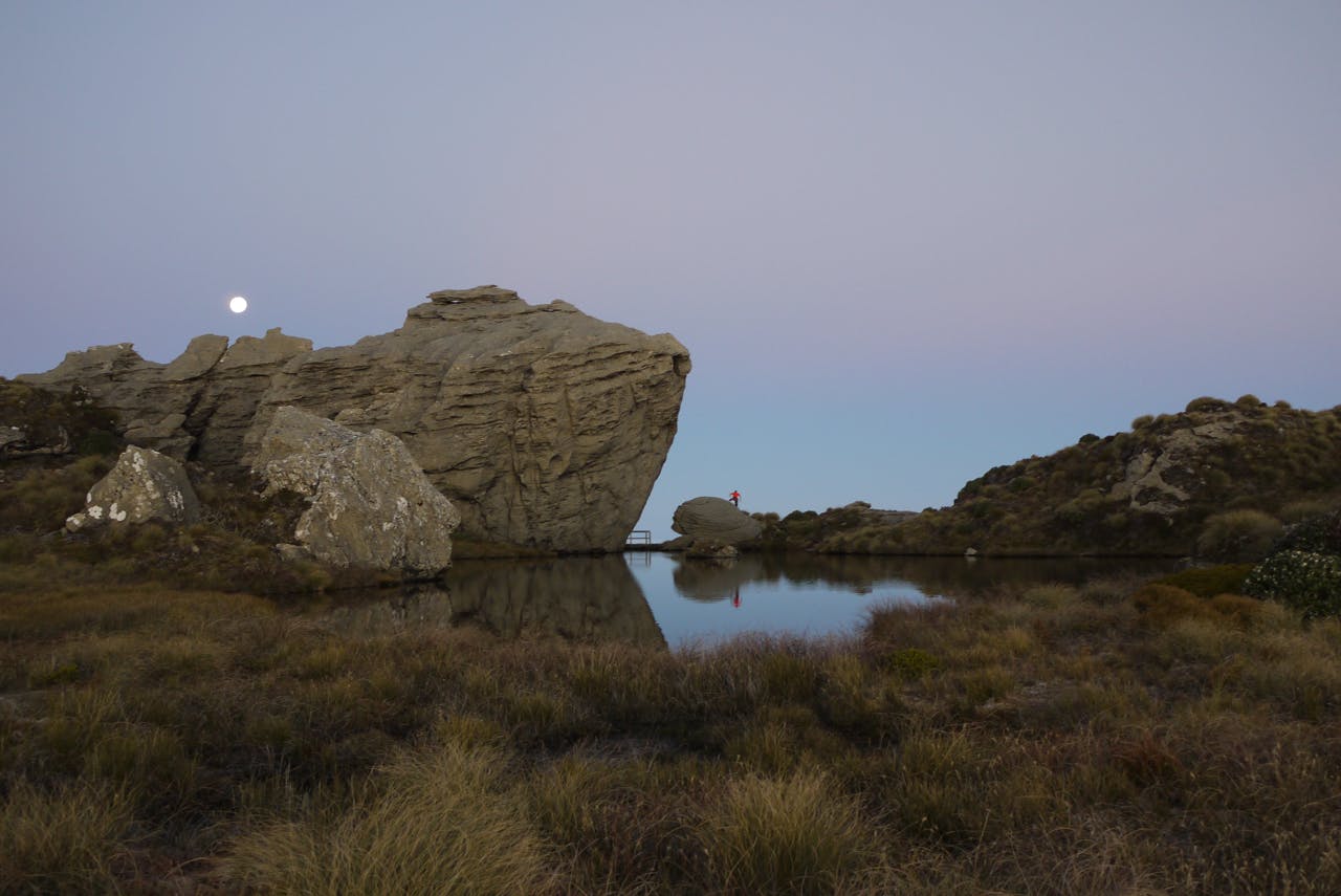A full moon rises above the large tarn and rock features on the Hump Ridge. Photo: Alistair Hall