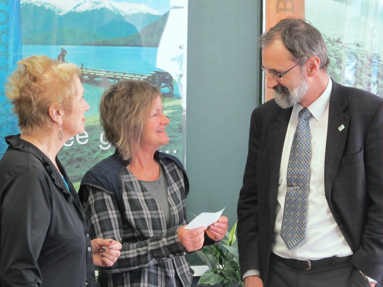 FMC’s Robin McNeil hands over a cheque for $1000 to Southland District Council Mayor Frana Cardno (left) and Save Fiordland Chairperson Daphne Taylor
