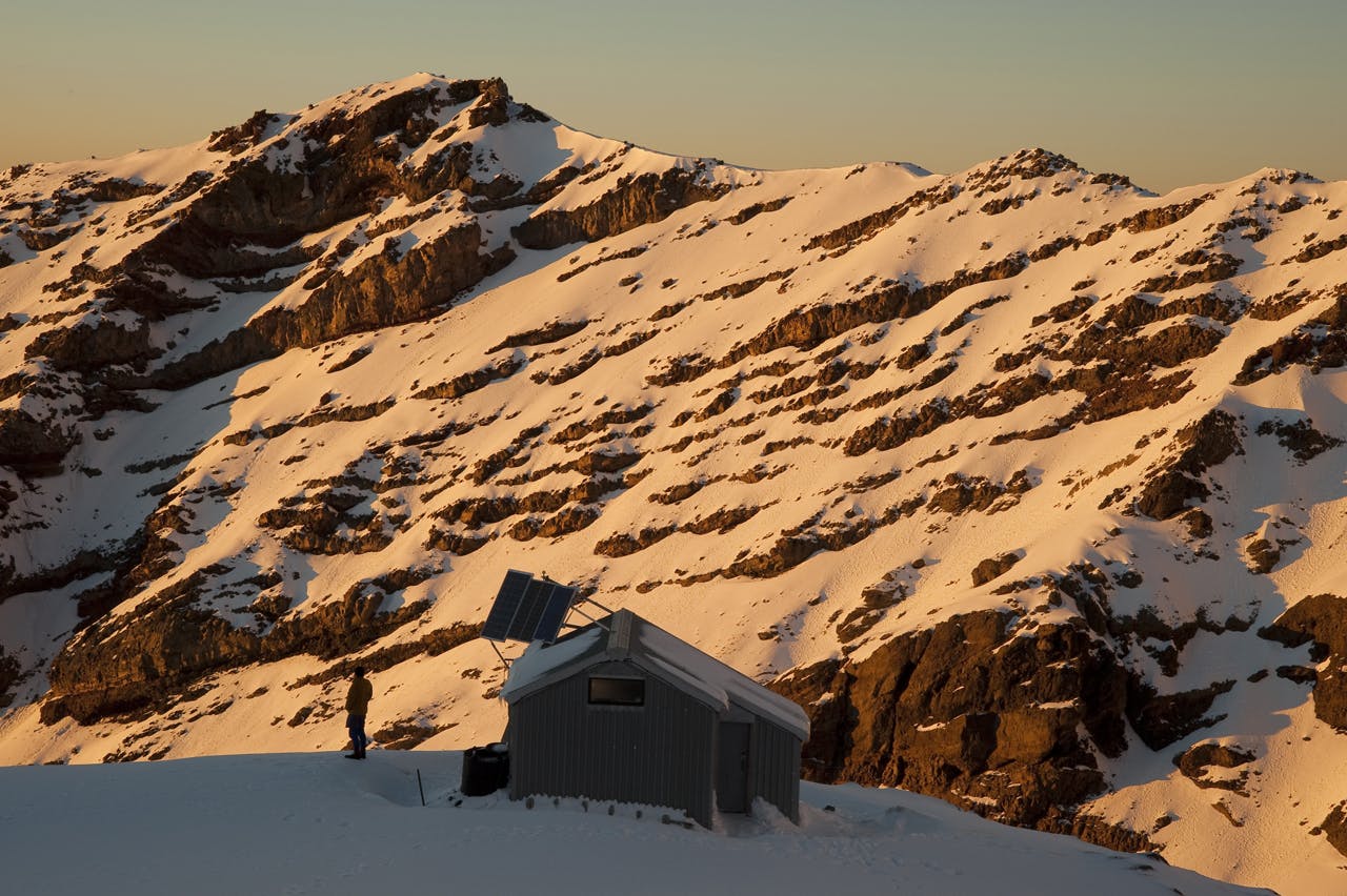 Sunrise on Whangaehu Hut and valley, Mt Ruapehu, Tonagriro National Park. Photo: Shaun Barnett