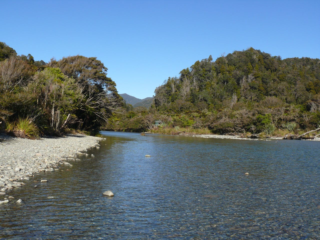 The mouth of the Stafford River with Stafford Hut nestled on its banks. Photo: Geoff Spearpoint