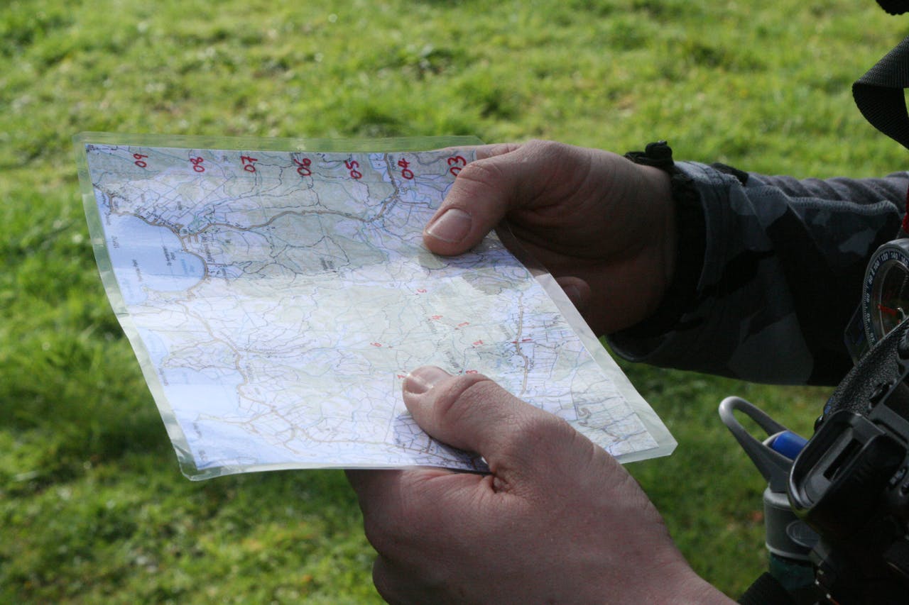 Small pre-prepared maps of the area you're traveling in are easier to handle than full topos. Photo: Josh Gale
