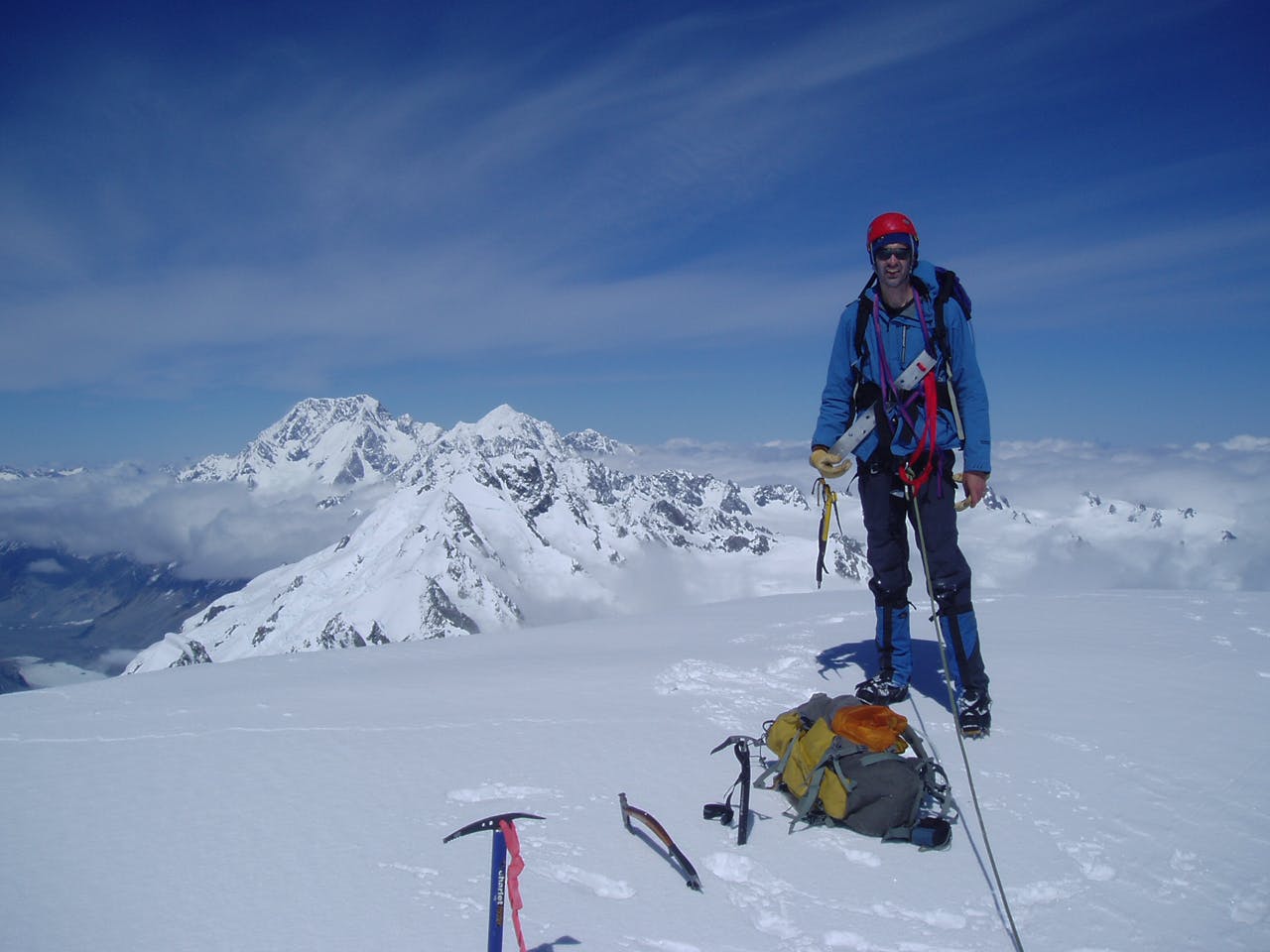 Darren on summit of Elie de Beaumont, with Cook and Tasman in background