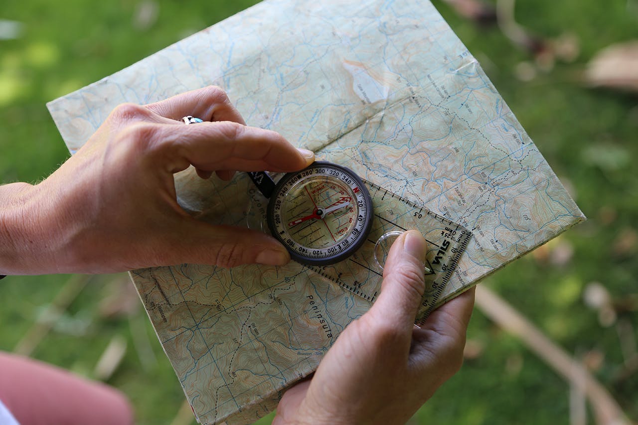 Rotate the dial to line up orienting lines