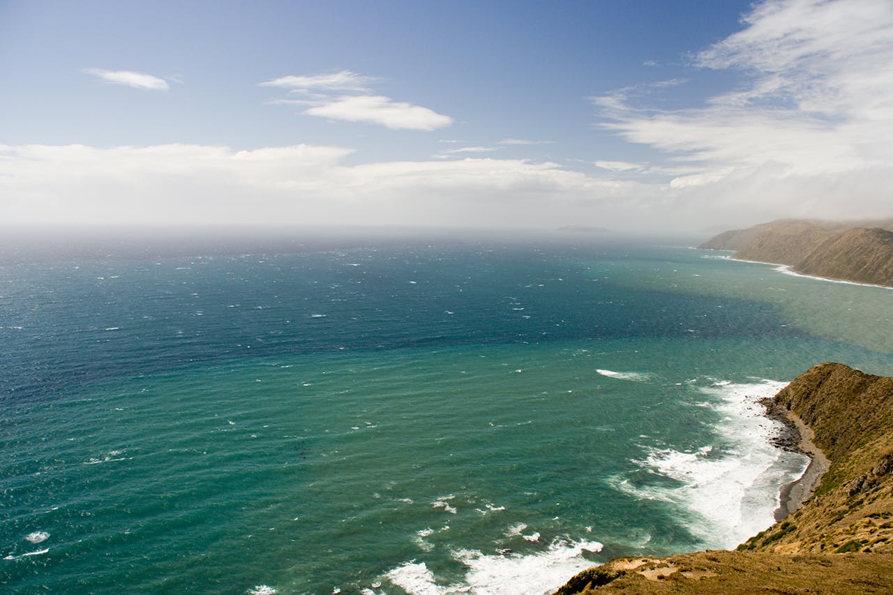In the deep blue sea near Mana Island, pictured in the distance, Rob Hewitt found himself floating for four days. Photo: Aidan / Creative Commons