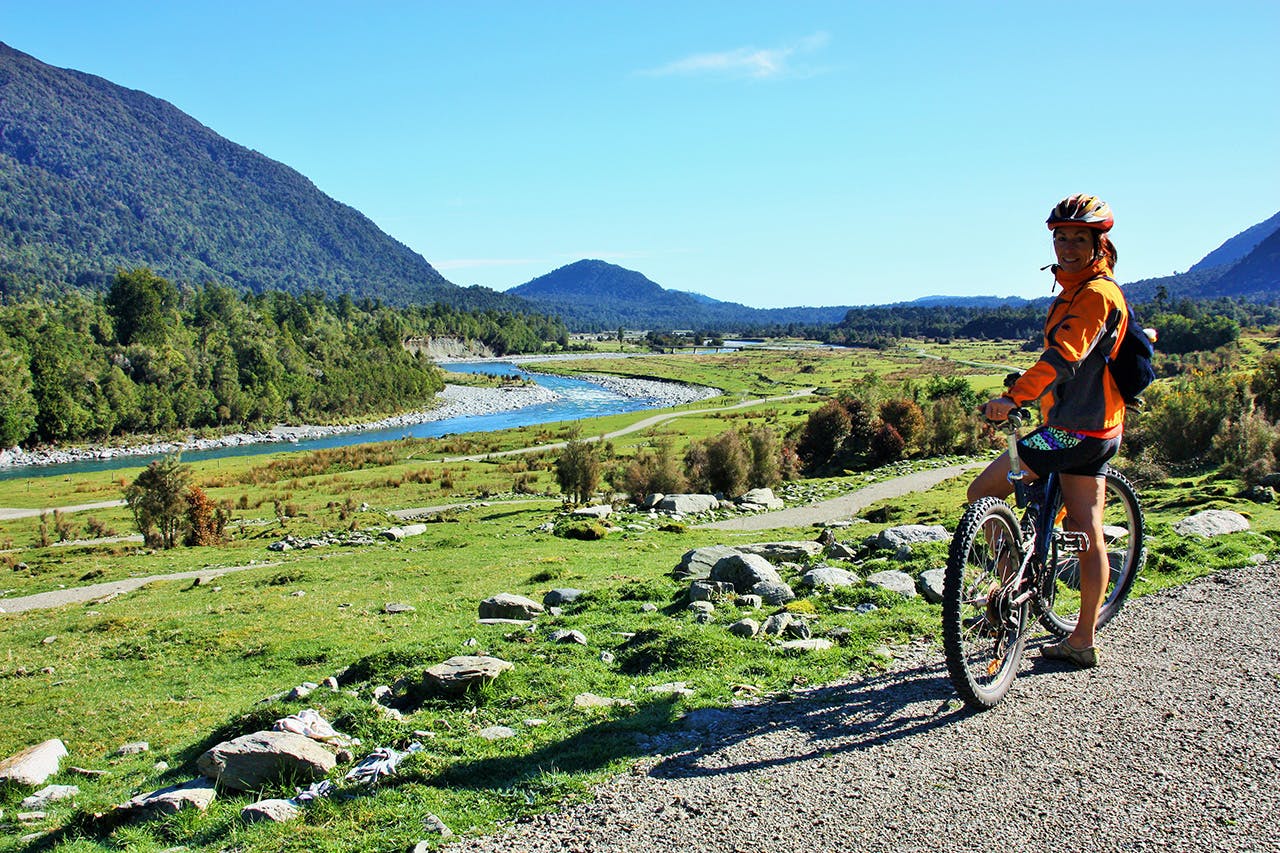 Admiring the Arahura Valley on the West Coast Wilderness Trail. Photo: Wilderness Trail Shuttle