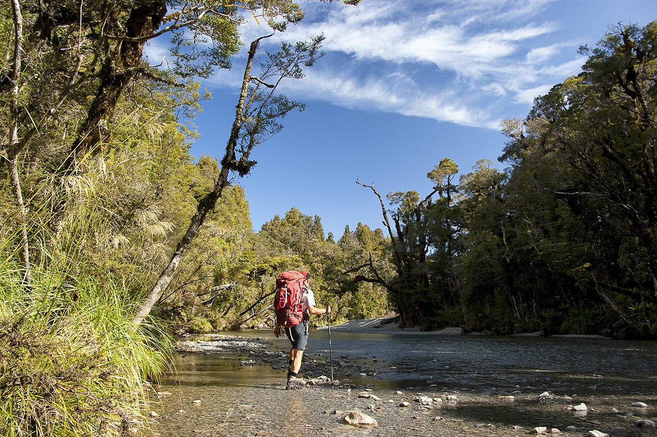 Splashing through the clear waters of the Smoothwater River en route to Stafford Hut. Photo: Ray Salisbury