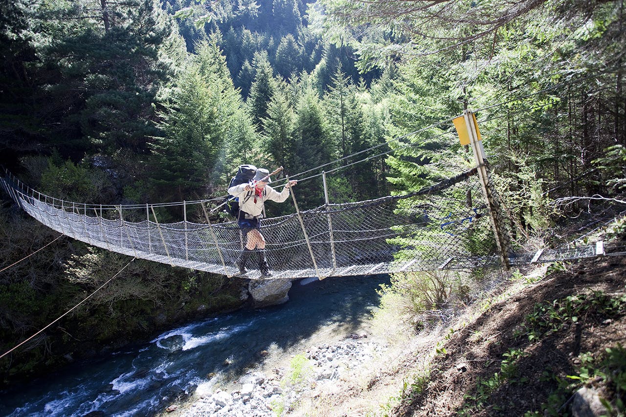 Crossing Greigs Hut swingbridge. Photo: Ray Salisbury