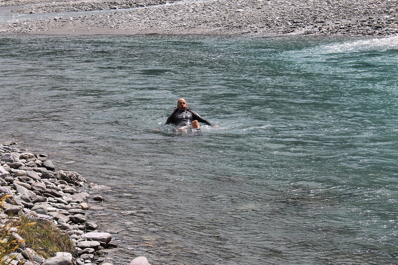 When knocked off your feet, lean into your pack and point your feet downstream. Photo: Carrie Miller