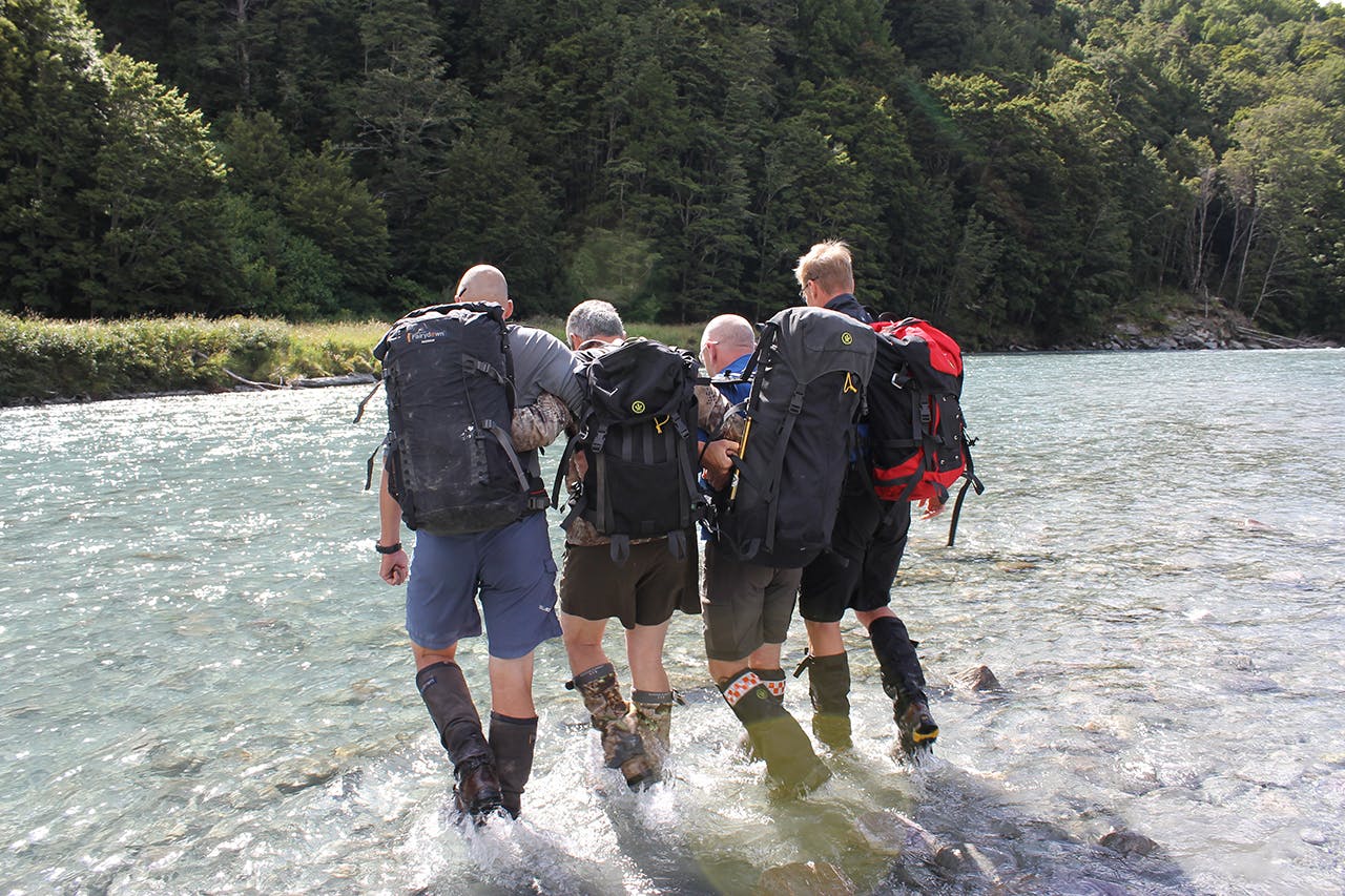 Strong people on each end, arms between your partner’s back and pack. Photo: Carrie Miller