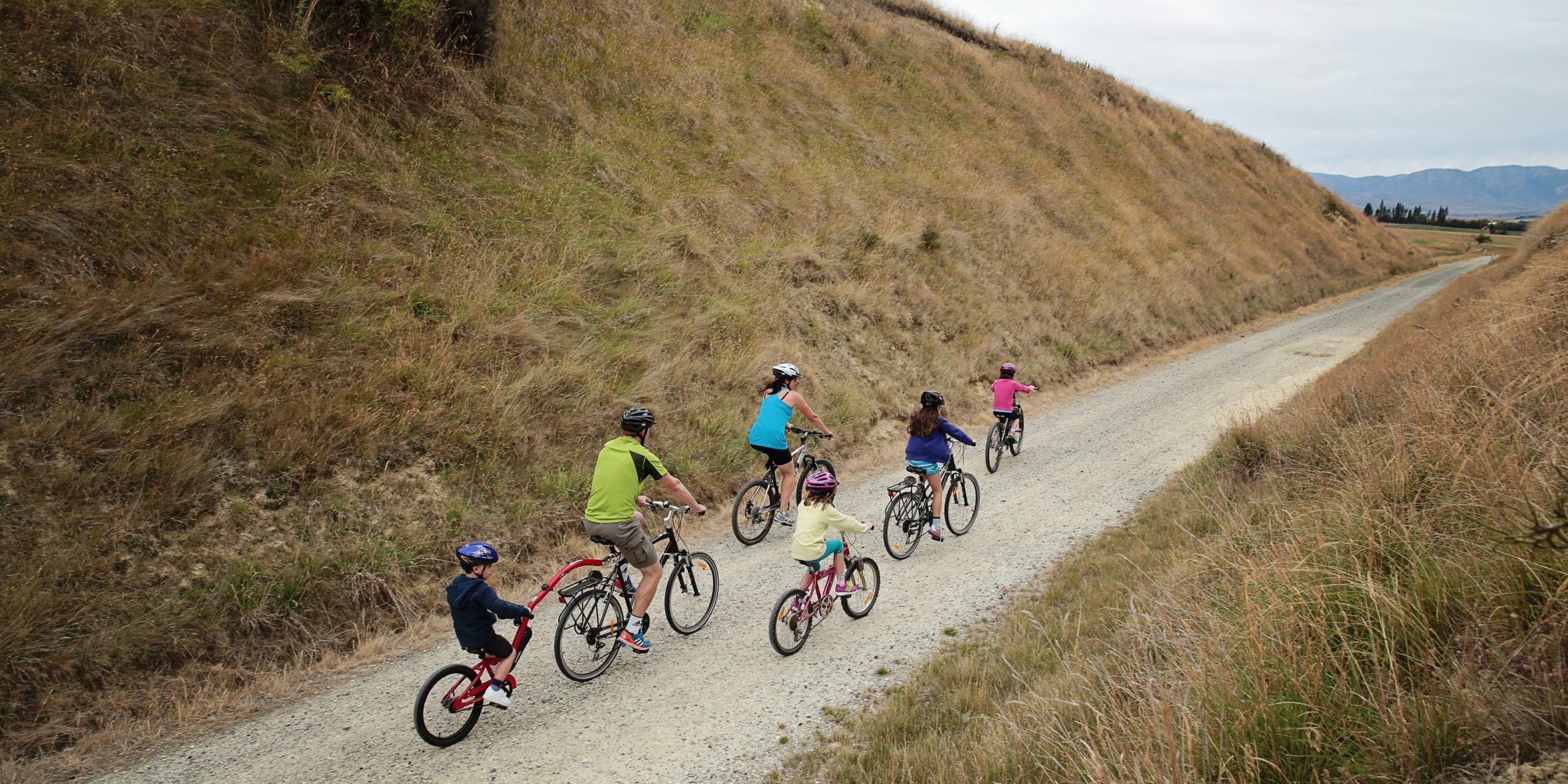 Happy family bike riding Wilderness Magazine